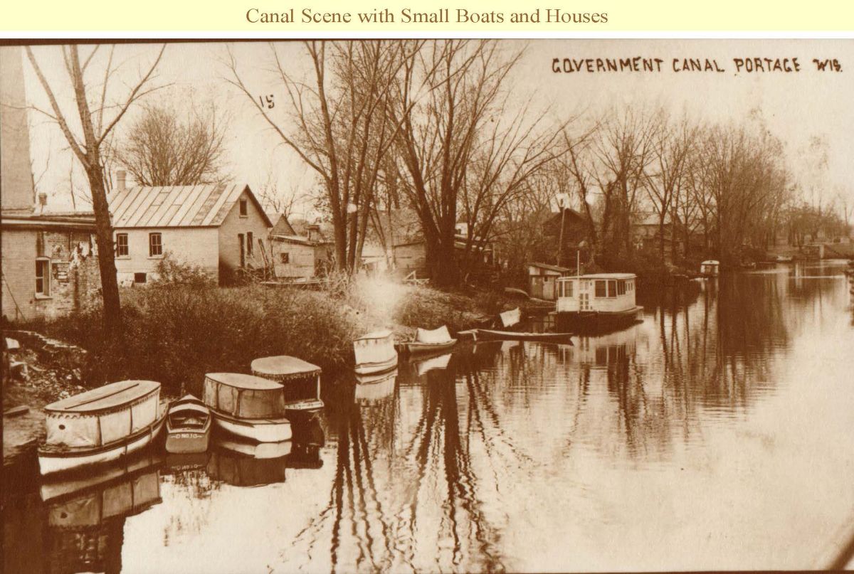 CANAL SCENE WITH SMALL BOATS AND HOUSES